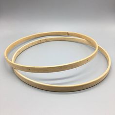 two wooden bangles sitting on top of each other