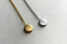 "Listing is for one locket on necklace, your choice of Silver or Gold. This small stainless steel round locket with satin finish speaks simplicity at its finest.  It hangs on an 16\" silver or gold stainless steel chain necklace, perfect for layering necklaces. The locket is approximately 12mm.   Arrives in an eco-friendly jewelry box, ready for gifting. MORE lockets in my shop! FREE SHIPPING! THANK YOU FOR VISITING MY SHOP!" Silver Minimalist Locket Necklace, Stainless Steel Locket Necklace With Round Pendant For Gift, Stainless Steel Locket Necklace Gift With Round Pendant, Stainless Steel Round Pendant Locket Necklace As Gift, Stainless Steel Round Pendant Locket Necklace, Silver Minimalist Locket Charm Necklace, Minimalist Silver Locket Necklace With Round Pendant, Everyday Silver Locket Necklace, Everyday Minimalist Round Pendant Locket Necklace