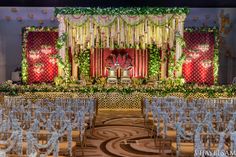 an elaborately decorated stage set up for a wedding