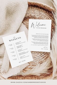 two wedding programs sitting on top of a wicker basket next to a white towel