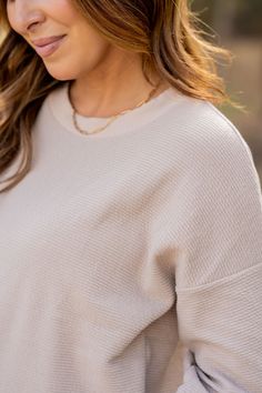 The feel of a sweatshirt with a chic vibe! The subtle woven textured look with the relaxed sleeves can be either dressed up or down to match your style! We love that this can be worn with shorts for the warmer months or denim, joggers, or our Betsey's Jeggings for the cooler ones. Chilly? Add a vest or jacket with ease! Simply add your favorite accessories to elevate this piece. Textured Crew Neck Top For Layering, Casual Beige Sweater For Loungewear, Comfy Soft Texture Tops For Spring, Chic Relaxed Fit Knit Top For Everyday, Chic Relaxed Fit Sweater For Loungewear, Casual Textured Knit Top For Spring, Relaxed Cream Tops For Fall, Trendy Tops With Soft Texture For Loungewear, Chic Tops For Layering With Ribbed Cuffs