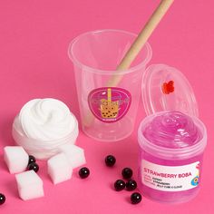 the contents of an ice cream and jelly shaker on a pink background with blackberries