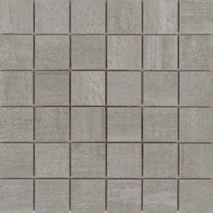 a gray tile wall that is very close to the ground