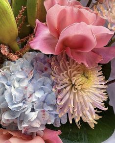 a bunch of flowers that are sitting on a table