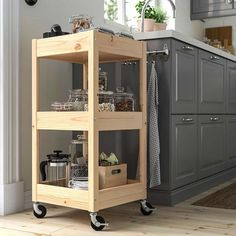 a kitchen cart with food and drinks on it