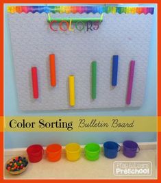 the color sorting bulletin board is filled with colorful plastic cups