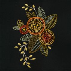 an embroidered flower with leaves on a black background