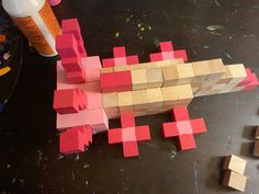 the blocks are made to look like a spaceman with pink and yellow squares on it