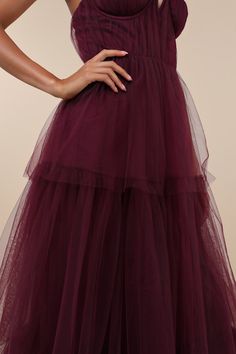 Making it an evening to remember is simple with a grand look like the Lulus Unforgettable Poise Plum Purple Tulle Bustier Tiered Maxi Dress! Airy, sheer tulle-mesh fabric shapes a bustier-style bodice with lightly gathered detailing throughout, padded cups with supportive underwire, and a sweetheart neckline (with a notched V-bar at the center), all supported by adjustable spaghetti straps. The high, fitted waist tops a tiered maxi skirt with a ballgown-inspired silhouette that will gracefully s Elegant Tulle Fabric For Bridesmaid And Prom, Bridesmaid Evening Dress With Tulle Skirt, Bridesmaid Tulle Evening Dress, Elegant Tulle Fabric For Bridesmaid Dresses, Elegant Floor-length Tulle Fabric For Bridesmaid, Sheer Tulle Tiered Skirt Dress, Sheer Tulle Dress With Tiered Skirt, Evening Tulle Dress With Tiered Skirt, Organza Bridesmaid Evening Dress With Tulle Skirt