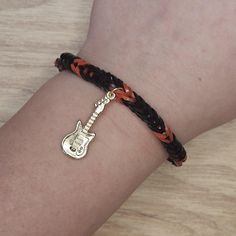 Rubberband bracelet with red, black, and a guitar charm. Red And Black Bracelets, Guitar Bracelet, Guitar Picks, Black Bracelets, Red And Black, Halloween Shopping, Labour Day, Jewelry Bracelets, Guitar