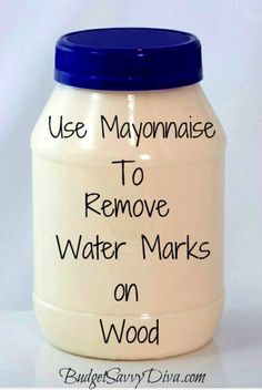 a white jar with blue lid that says use mayonnaise to remove water marks on wood