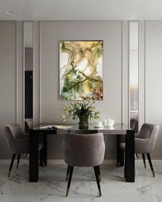 a dining room table with chairs and a vase filled with flowers on top of it