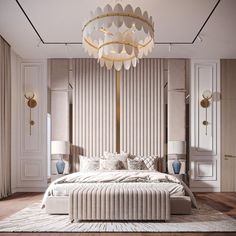 a large white bed sitting under a chandelier in a bedroom next to two lamps