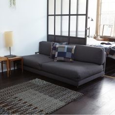 a living room filled with furniture and a large window