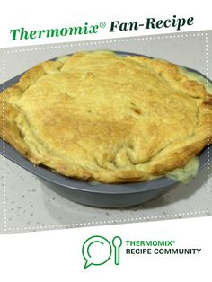 there is a pie in the pan on the table with words above it that read thermomiia fan - recipe