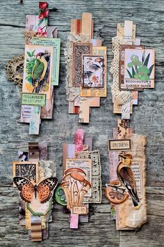 altered art pieces are displayed on a wooden surface with birds and flowers in the background