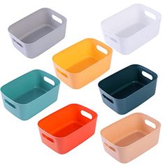 six different colored plastic containers with handles