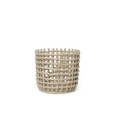 a white basket that is made out of wood and has an oval design on the side