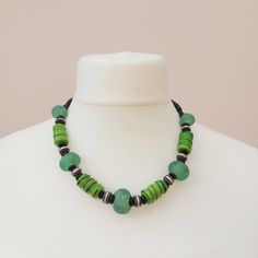 - Rare glass and wood necklace. Hand painted wood beads and stunning chunky handmade glass beads in black and green.  - Original vintage necklace  - 53 cm in length   - A little wear to the drum shaped beads, otherwise in really good condition.  Gift wrapping available, including card and envelope. Please specify at checkout. Shipping & Delivery: - International: Tracked  - Within the U.K: First class and signed, tracked with Royal Mail Painted Wood Beads, Handmade Glass Beads, Wood Necklace, Hand Painted Wood, Chunky Necklace, Green And Black, Glass Necklace, Wood Beads, Vintage Necklace