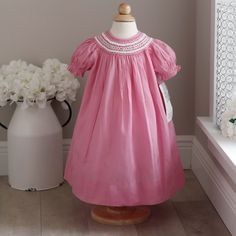 This Strasburg Smocked Pink Bishop Dress In Size 12 Months Is Adorable. A Limited Edition Raspberry Pink Color That Is No Longer In Production Makes It A Rare Find In New Condition !! Beautiful Hand Smocked Neckline With White Satin Ribbon Woven Throughout The Smocking. Sweet Little Hand Embroidered Rosettes Are The Finishing Touch! Beautiful Hand Made Strasburg Quality! New With Tags! Matching Sister/Cousin Dresses Available Also-See Listings 21" Long From Top Of Shoulder To Bottom Of Hem Raspberry Pink Color, Duck Dress, Tartan Plaid Christmas, Hand Smocked Dress, Velvet Party Dress, Matching Sisters, Heirloom Dresses, Hand Smock, Raspberry Pink