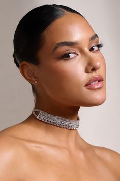 Catch the lights of any formal setting wearing our classic Jazmin choker necklace. Encrusted with layers of different diamantes and plated in silver. this necklace would pair perfectly with our white Rule Breaker crop top and matching Ground Rules skirt.Features- Choker style- Crystal embellishmentsProduct InformationDesigned exclusively by Club L LondonSilver-toned brass (60% Brass. 40% Glass)SKU: CL128499013Returns InformationEarrings and pierced jewellery cannot be returned for health and hyg Party Rhinestone Choker Necklace, Evening Clavicle Chain Choker, Dazzling Silver Party Choker, Evening Rhinestone Choker Necklace, Formal Rhinestone Clavicle Choker Necklace, Sparkling Silver Choker, Formal Rhinestone Choker Necklace, Glamorous Cubic Zirconia Rhinestone Choker, Glamorous Cubic Zirconia Choker Rhinestone Necklace