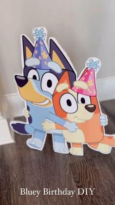 a birthday card with two cartoon dogs wearing party hats