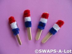 four toothpicks decorated in the colors of the american flag