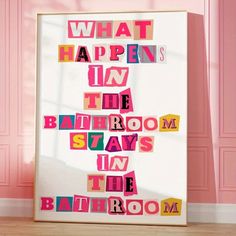 the bathroom is in the bathroom with pink walls and wood flooring, which has cut out letters on it