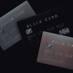 three credit cards are shown in black and silver