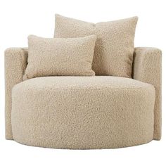 a large round chair with four pillows on it's back and two side by side