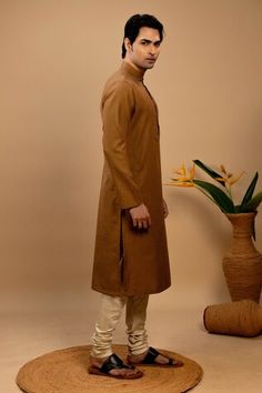 Beige straight kurta with printed panels on the placket. Paired with a straight churidar. - Aza Fashions Fitted Brown Kurta For Diwali, Brown Cotton Kurta With Dabka, Brown Straight Kurta For Diwali, Fitted Handloom Straight Kurta, Brown Cotton Traditional Wear For Eid, Festive Brown Cotton Traditional Wear, Designer Beige Straight Kurta Churidar, Unstitched Brown Cotton Traditional Wear, Brown Straight Kurta For Eid