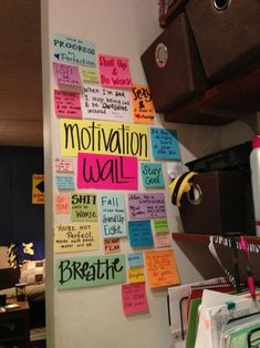 a bulletin board with motivational notes on it