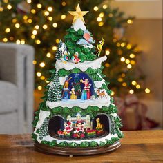 a small christmas tree on top of a wooden table