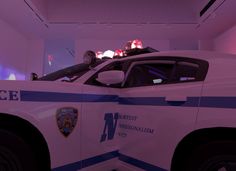 a police car is parked in a room