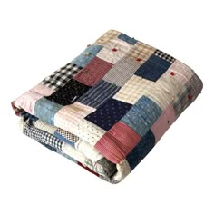 a quilted blanket is folded on top of each other in different colors and patterns