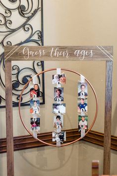 a wooden sign with photos on it that says guess them ages in front of a mirror