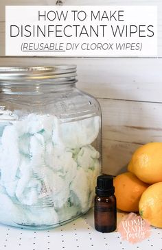 a jar filled with disinfectant wipes next to lemons