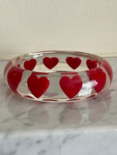 Beautiful Vintage Red Heart Clear Bangle, Clear lucite bangle with red hearts all the way round.  Very good condition very clear and shiny Perspex  Internal diameter 6.5 cm  Width 2cm Lucite Bangle Bracelet As Gift, Lucite Bangle Bracelet For Gift, Lucite Bangle Bracelets As Gift, Vintage Jewlery, Glass Bangles, Thrift Finds, Diy Resin, Red Hearts, Resin Diy