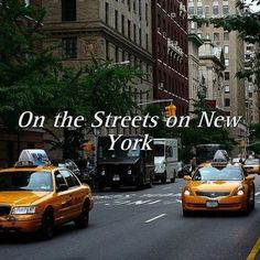 taxi cabs are driving down the street in new york city, with words on it