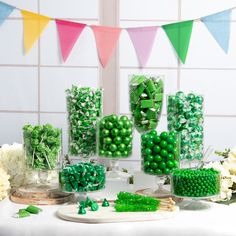 there are many green candies on the table