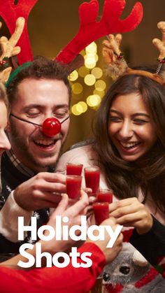 three people in reindeer antlers drinking red wine and smiling at the camera with text holiday shots