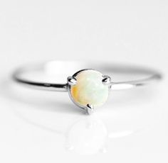 Artisan Ethiopian Opal Ring, 925 Sterling Silver, Round Gemstone, Affordable Silver Ring, Cheap Ring, Can Be Personalized, Christmas, Sale Ring Metal :- 925 Sterling Silver (Stamp on the Product) **Gemstone Size depends on the Ring Size.** **The Product you will receive may vary from the image as no two gemstone are similar and images cannot define exact product definitions.** Shipping Policy:- I mainly use DHLE, PPS, FedEx for the shipping of goods depending on the amount and days that you have Fine Jewelry Opal Ring With Round Stone For Gift, Silver Opal Birthstone Ring Gift, Opal Birthstone Ring In White Gold For Gift, Fine Jewelry Opal Ring For Gifts, Fine Jewelry Opal Ring Gift, Silver Opal Stackable Rings As Gift, Fine Jewelry Opal Ring With Round Band As Gift, Fine Jewelry Opal Ring As A Gift, Sterling Silver Opal Ring With Bezel Setting As Gift