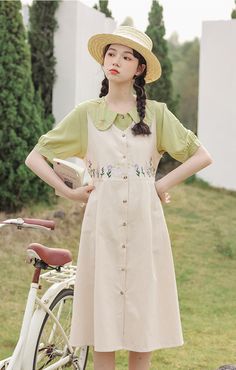 Wild Garden Button Pinafore Dress (3 Colors) Beige Pinafore Dress Outfit, Spring Cottagecore Daywear Dresses, Casual Floral Embroidered Dress For Spring, Casual Floral Embroidery Dress For Spring, Spring Dresses With Buttons For Garden Party, Casual Spring Dress With Floral Embroidery, Spring Garden Party Dress With Buttons, Cottagecore Dresses With Buttons For Garden Party, Pastoral Green Dresses For Spring