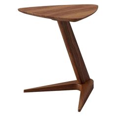 a small wooden table with an upside down design on the top and one leg that is bent