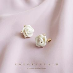 White Cloud Porcelain Rose Stud Earrings SKU: E_028 PRODUCT INFO Our lovely white cloud roses are inspired from the beautiful English garden. Delicate and lovingly handcrafted, the roses experienced more than 15 hours kiln firing, with temperature reaching 1280oC. The white cloud roses are surrounded by some tiny sparkling Cubic Zirconia Stones. Don't you think they would be the perfect gift to spoil yourself or your special someone? MATERIAL Handmade porcelain roses 14K gold-filled ear posts an Everyday Jewellery, Rose Stud Earrings, Jewellery Wedding, Porcelain Roses, Handmade Porcelain, Porcelain Jewelry, Kiln Firing, White Cloud, Bridal Jewellery