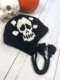 Introducing our Gothic Fashion Beanie, a must-have accessory for any edgy and alternative wardrobe.  This Black  Beanie features a classic black color and is adorned with gothic skulls, making it the perfect accessory for fans of the goth subculture.  Hand knitted with durable Wool and fully with soft fleece. Unisex design, handmade  Perfect beanie for this Winter. Made with 100%  New Zealand wool, lined with soft fleece.  Unique gift for your loved ones who are into gothic style.  Warm cap to w Adjustable Punk Hat For Winter, Adjustable Punk Winter Hat, Adjustable Punk Style Winter Hat, Casual One Size Hats For Halloween, Casual One-size Hats For Halloween, Casual One Size Halloween Hats, Black Knitted Hat For Halloween, Punk Winter Hat For Festivals, Black Novelty Beanie One Size Fits Most