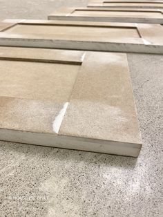 several pieces of concrete sitting on top of a floor