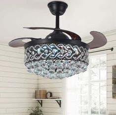 PRICES MAY VARY. STUNNING FANDELIER: Top K9 crystal with premium black lamp body, the light on and off will show a different beauty. It is both a practical chandelier fan and a gorgeous decorative piece REMOTE CONTROL: 42"chandelier with fan has 3 color changes (cool-6500k/neutral-4500k/warm-3000k), timer setting (1/2/4/8h), 3 fan speeds, all functions can be controlled individually with the remote control RETRACTABLE CEILING FAN: High-quality ABS amber blade will automatically expand and contra Chandelier Ceiling Fans, Chandelier With Fan, Elegant Ceiling Fan, China Cabinet Bar, Fandelier Ceiling Fan, Retractable Ceiling Fan, Crystal Ceiling Fan, Ceiling Fan With Lights, Ceiling Fans With Lights