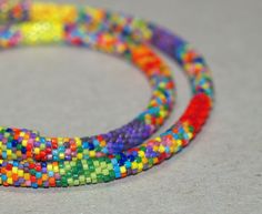 multicolored beaded bracelets on grey surface