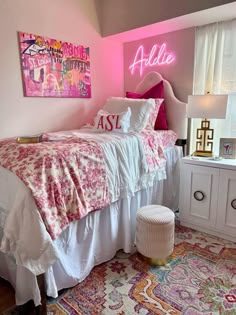 a bedroom with pink walls and white bedding